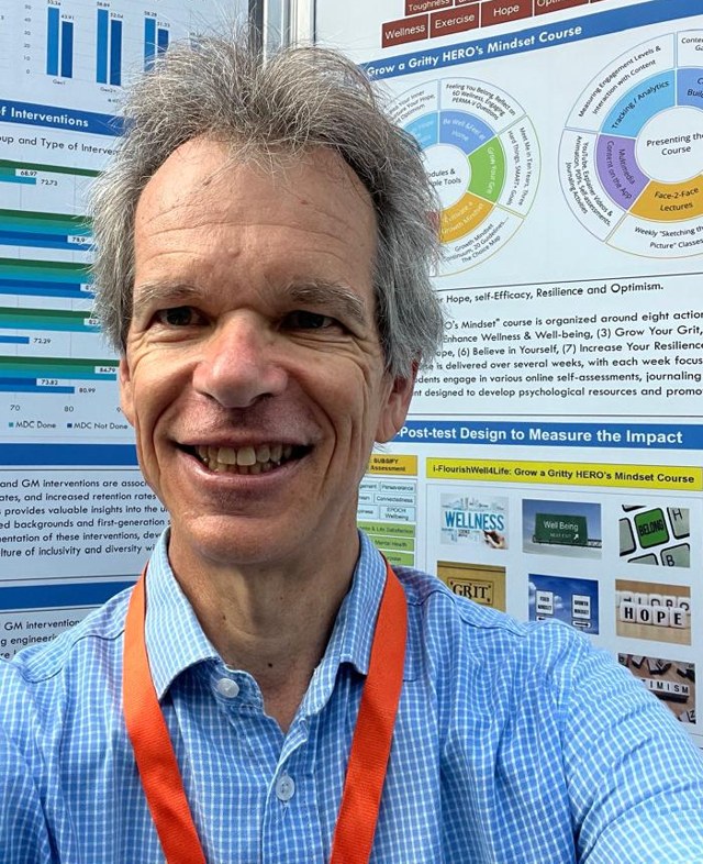 Dr Alten du Plessis at a research-conference poster of his flourishing work